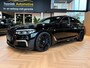 BMW 5-Serie M550i xDrive High Executive Bom vol | leder | beeldschermen achterin | en een adembenemend geluid
