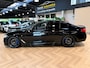 BMW 5-Serie M550i xDrive High Executive Bom vol | leder | beeldschermen achterin | en een adembenemend geluid