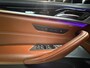 BMW 5-Serie M550i xDrive High Executive Bom vol | leder | beeldschermen achterin | en een adembenemend geluid