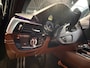 BMW 5-Serie M550i xDrive High Executive Bom vol | leder | beeldschermen achterin | en een adembenemend geluid