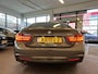 BMW 4-Serie Gran Coupe 418i Individual M-pakket Schuifkanteldak/Automaat/Navigatie/Climate controle/Cruise cotrole/Lederen bekleding+stoelverwarming/Xenon/LED dagrijverlichting/Parkeersensoren achter/Nederlandse auto/Dealeronderhouden