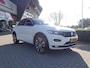 Volkswagen T-Roc 1.5 TSI 150pk 7-DSG Sport Business R met 4 Nieuwe 4 Seizoenenbanden