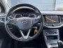 Opel Astra Sports Tourer 1.4 Turbo Online Edition ✓150pk✓2e Eigenaar✓Camera✓Carplay✓Navi✓Pdc V+A✓Stoelverw✓Stuurverw✓Clima✓Cruise✓Lm velgen✓6 Bak✓Comfortstoelen✓Dealer Onderhouden✓N.A.P✓Bj 12-2018✓Apk tot 01-2027