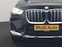 BMW iX1 xDrive30 X Line 67 kWh 313pk Dealer O.H. | Trekhaak Af Fabriek | Panodak | Head Up | Adaptive Cruise | 360 Camera | Harman / Kardon | Lederen Sportstoelen Massage & Memory | Keyless | Sfeerverlichting | Stoelen & Stuur Verwarmd | Apple Carplay | Widescreen Navi | DAB | 19"L.M |