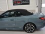 BMW 4-Serie Cabrio 420i High Executive M-Sport Sportstoelen Camera Curved dash Navigatie Airco-ecc 19 inch Sportvelgen App connect Cape York Green metallic Zwart sportleer