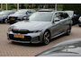 BMW 3-Serie Touring 330e / SoH 88,5% / Trekhaak / Panoramadak / Camera / Head-up / 18'' / Keyless / Laser LED / Sfeerverlichting / Stoelverwarming / Dodehoek / DAB / ACC