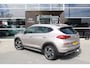 Hyundai Tucson 1.6 T-GDI Premium | Automaat | Stoelverwarming voor+achter | Adaptieve Cruise Control | Electrisch verstelbare bestuurderstoel | Trekhaak | Navigatie | | Achterbank in delen neerklapbaar | Achterbank verwarmd | Airco (automatisch)