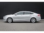 Ford Mondeo 1.5 165pk Titanium 5-deurs | 1 eigenaar | 100% dealer o.h. | NAP | 17 inch | Stoelverwarming | LED-verlichting | Privacy-glass | Elec. stoel incl memory | Keyless entry & start