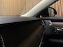 Volvo V90 T8 AWD Recharge Ultimate Dark | Bowers & Wilkins | Luchtvering | Stoelventilatie | Schuifdak | Head-Up Display | Stoelmassage | 455pk | Adaptieve Cruise Control | Stoelverwarming voor+achter | Stuurwielverwarming | 20 Inch | Full LED  Meesturende koplampen | Parkeercamera | Pilot Assist | BLIS Dode Hoek Detectie | Elektrische voorstoelen geheugen | Nappa Lederen bekleding | Zitting verlenging voorstoelen | Lederen Dashboard | Google Infotainment | Keyless Drive | Parkeersensoren voor+achter | Privacy Glass | Elektrisch bedienbare achterklep | Geïntegreerde zongordijnen achterportieren | DAB Radio | Apple Carplay/Android Auto | Volvo On Call met mobiele App functie | Denim Blue Metallic |