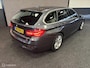 BMW 3-Serie Touring 320i High Executive SPORTLINE / LEDER / AUTOMAAT / TR.HAAK / NAVI / STOELVERW. /