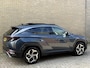 Hyundai Tucson 1.6 T-GDI 265 PHEV Premium Sky 4WD | Panoramadak | Trekhaak afneembaar | Lederen bekleding | Memory | 360 camera | Stoelverwarming&ventilatie | Stuurverwarming | Adaptieve cruise | Navigatie | LED | DAB | Apple CarPlay | Elektrische achterklep | Dealeronderhouden | Fabrieksgarantie