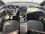 Hyundai Tucson 1.6 T-GDI PHEV N Line Sky 4WD / Panoramadak / 360° camera / Adaptive cruise control / Stoelventilatie / Stoelverwarming voor + achter / Stuurwielverwarming / Elektrisch verstelbare voorstoelen / Elektrische achterklep / Keyless entry & start / Apple CarPlay & Android Auto / Navigatie / Draadloos telefoonladen / LED verlichting / 19” N Line velgen / Dodehoekdetectie / Parkeersensoren voor + achter / Climate control / Privacy glass / N Line interieur & exterieur