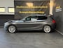 BMW 1-Serie 120i High Executive | Schuifdak | Navi | Stoelverwarming | LMV | Cruise | PDC