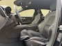 Volvo V60 2.0 T6 Recharge 350pk AWD R-Design Plus Dark | Long range | Trekhaak wegklapbaar | Pilot assist | Adaptieve cruise | Stoelverwarming | Camera | Sportstoelen half leder met memory | 19 inch velgen | Navigatie | Apple CarPlay | DAB | Keyless | Full-LED | Sfeerverlichting | Elektrische achterklep | Recent onderhouden