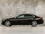 Mercedes-Benz C-klasse 180 AMG Sport 156Pk Automaat (NAVIGATIE, CAMERA, LEDER, ZWART HEMEL, STOELVERWARMING, SPORTSTOELEN, GETINT GLAS, NIEUWSTAAT)