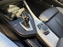 BMW 1-Serie M135i High Executive / AUTOMAAT / SCHUIFDAK / LEER / NAVI / HARMAN KARDON
