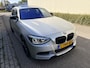 BMW 1-Serie M135i High Executive / AUTOMAAT / SCHUIFDAK / LEER / NAVI / HARMAN KARDON