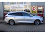 Ford Focus Wagon 1.0 EcoBoost Hybrid Titanium O.a: PDC, Trekhaak, Navi, Clima, Cruise, DAB, Etc. All-in prijs!