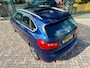 BMW 2-Serie Active Tourer 218i Centennial High Executive, NAP, PANO, Trekhaak, Leder
