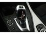 BMW 1-Serie 118i High Executive (STOELVERWARMING, CRUISE CONTROL, NAVIGATIE, PARKEERSENSOREN, DEALER ONDERHOUDEN)