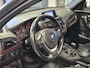 BMW 1-Serie 116i Upgrade Edition Open dak | Navigatie | Volleder | Trekhaak | Stoelverw.