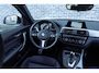 BMW 1-Serie 118i Edition M Sport Shadow Executive | Achteruitrijcamera | Parkeerassistent | Sportstoelen | LED Koplampen | Privacy Glas | Cruise Control | Lichtmetalen Velgen 18 inch | Navigatie Business