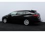 Opel Astra Sports Tourer 1.2 Elegance/ Trekhaak/ 16'' LMV/ LED Koplampen!/ Stoel + Stuurverw./ Camera/ Apple + Android/ Half-Leder/ Dode-Hoek DET./ Extra getint glas/ PDC V+A/ Navi/ Clima/ Cruise/ Bluetooth.