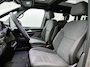 Volkswagen Multivan 1.5 eHybrid L1 Bulli Edition 4Motion 245PK | FACELIFT! | Automaat | Trekhaak | Elektrische Schuifdeuren | Elektrische Achterklep | Achteruirijcamera | Verwarmbare Voorstoelen | Verwarmbare Voorruit | Trekhaak | 7-Zits Vis-a-Vis | Multifunctioneel Stuurwiel | Verschuifbare Tafel | Adaptive Cruise Controle | Navigatie | IQ.Light | Glazen Panorama Dak |