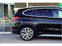 BMW X1 sDrive20i Orange Edition II | Panorama | Trekhaak | ACC | Leer | H/K