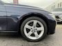 BMW 3-Serie 320i High Executive | Airco | Cruise Control | Trekhaak | NAVI | Bluetooth | Leder