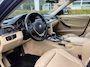 BMW 3-Serie 320i High Executive | Airco | Cruise Control | Trekhaak | NAVI | Bluetooth | Leder