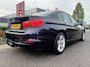 BMW 3-Serie 320i High Executive | Airco | Cruise Control | Trekhaak | NAVI | Bluetooth | Leder