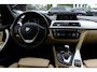 BMW 3-Serie 320i Corporate Lease High Executive / Trekhaak / Schuifdak / Leder / Navigatie / Parkeerhulp V+A / 18'' / Getint glas / Stoelverwarming / Cruise Control