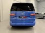 Volkswagen Multivan 1.4 eHybrid Life 7p. TREKHAAK/EL.SCHFDEUREN+SCHUIFRUITJES/ACC/SFEER/SOH 93%/CAMERA/CARPLAY/KEYLESS/LED/EL.A.KLEP/MIDDENCONSOLE/DODE-HOEK/PRIVACY/17"BLACK/FLORIDA-BEACH BLUE METALLIC/VOLLEDIG VW DEALER HISTORIE