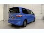 Volkswagen Multivan 1.4 eHybrid Life 7p. TREKHAAK/EL.SCHFDEUREN+SCHUIFRUITJES/ACC/SFEER/SOH 93%/CAMERA/CARPLAY/KEYLESS/LED/EL.A.KLEP/MIDDENCONSOLE/DODE-HOEK/PRIVACY/17"BLACK/FLORIDA-BEACH BLUE METALLIC/VOLLEDIG VW DEALER HISTORIE