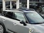 MINI Countryman 1.5 Cooper S E ALL4 | Orig. NL | PanoramaDak | JCW-pakket | Carplay | Camera | Head-Up display |