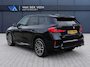 BMW X1 sDrive18i M-Sport | Panorama dak | Elektrisch wegklapbare trekhaak | Stoelverwarming | Achteruitrijcamera | Elektrische kofferbakklep | Keyless entry/start | Half leder/alcantara | Draadloze telefoonlader | Apple CarPlay/Android Auto | Navigatie | Climate controle | Parkeersensoren V+A |