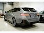 BMW i5 Touring eDrive40 84 kWh * SoH 96% - Trekhaak - Head Up - 360° - Stoelventilatie - Iconic Glow - ACC - Dodehoek *