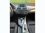 BMW 1-Serie 116d 116pk AUT 2015 Zwart CRUISE|TREKHAAK|2E EIGENAAR