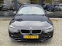 BMW 3-Serie Touring 320i Luxury + PANO DAK + LED + HALF LEER